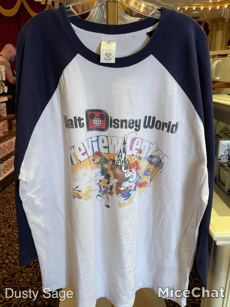 https://www.micechat.com/wp-content/uploads/2021/09/magic-kingdom-main-street-cinema-walt-disney-world-50th-anniversary-merchandise-vault-collection-preview-center-raglan-shirt.jpg