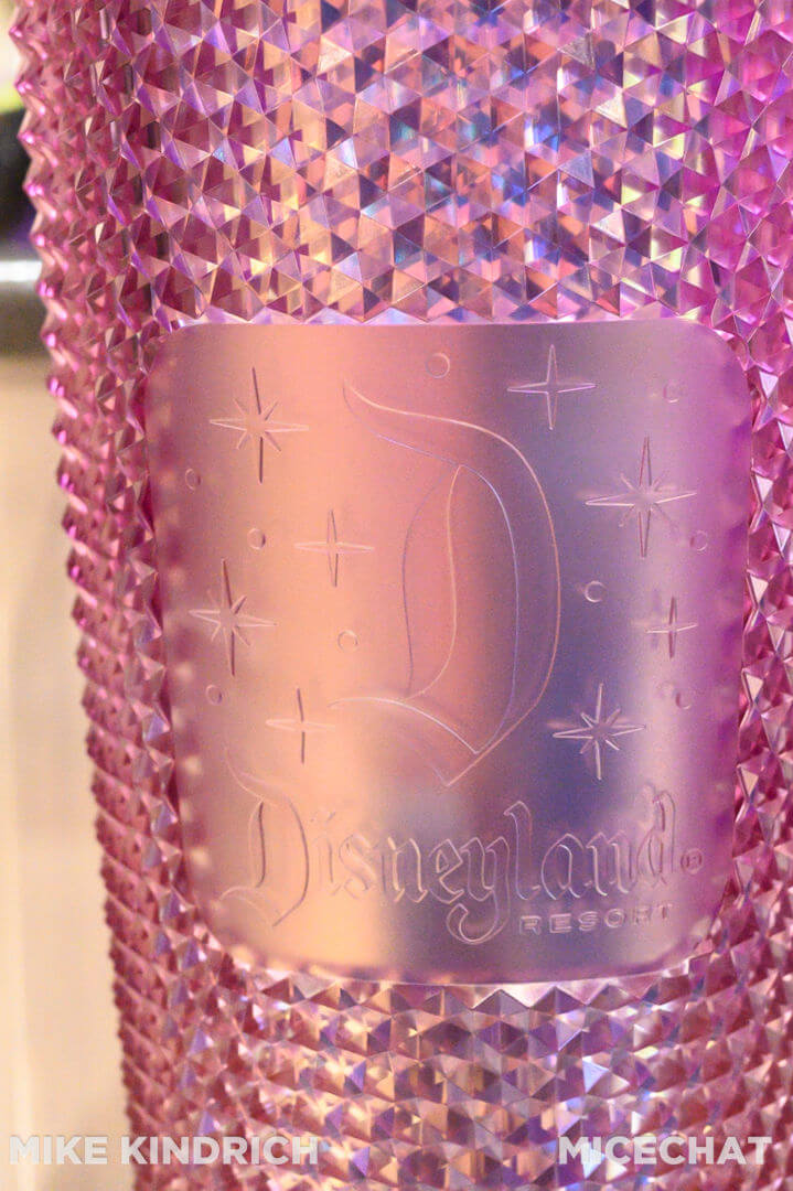 https://www.micechat.com/wp-content/uploads/2022/01/downtown-disney-world-of-disney-disneyland-starbucks-iridescent-pink-studded-tumbler-with-straw-detail.jpg