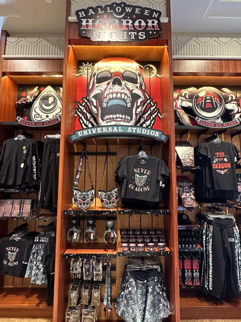 Halloween Horror Nights merchandise never go alone display - MiceChat